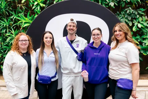 Five people posing for picture
