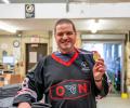 James Walker holding a medal