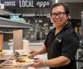 Juan Platero holding a breakfast plate at Saugeen-Maitland Dining Hall.